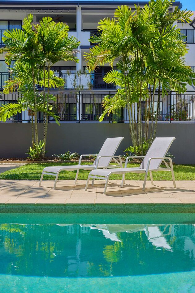 poolside loungers at tropical rental house or apartment in Cairns