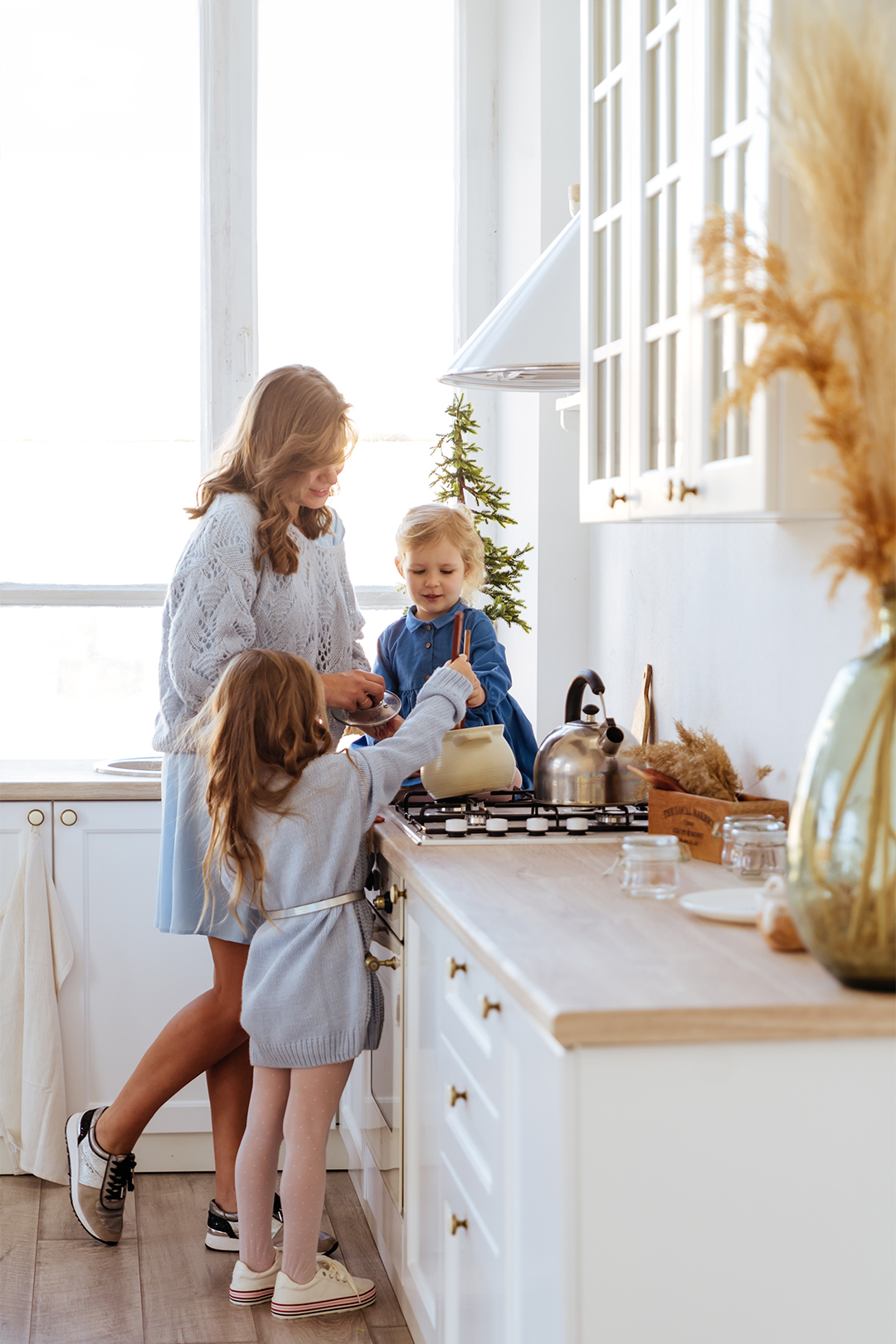 Young family baking together in their bright Cairns rental property